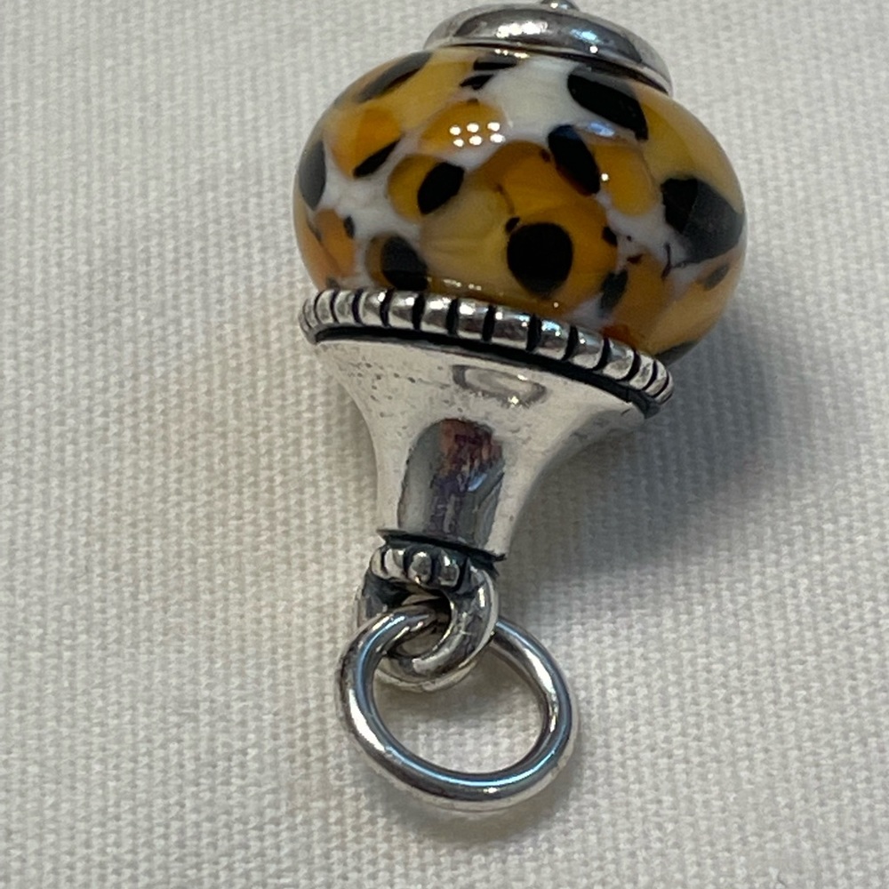 Retired James Avery glass charm/pendant